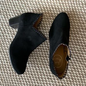 Black suede booties on 2” heel